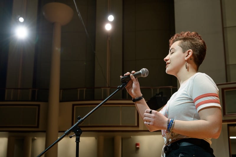 Sydney Cargill sings an a capella version of Adele’s "Skyfall" on stage at the Gore Recital Hall.